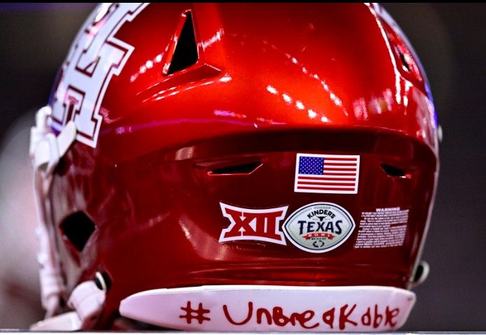 UH Red Football Helmet with Unbreakable
