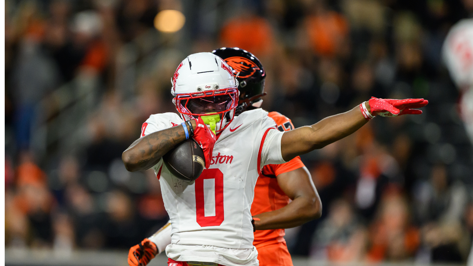 Sep 26, 2025; Corvallis, Oregon, USA; Houston Cougars wide receiver Amare Thomas (0) celebrates a catch and first down during the second quarter against the Oregon State Beavers at Reser Stadium