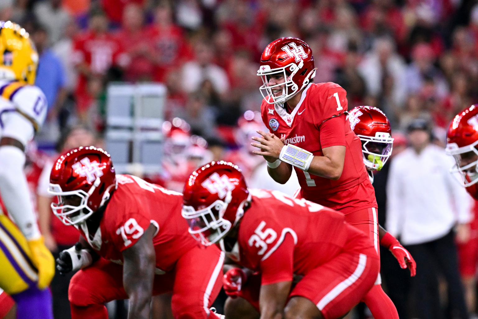 Dec 27, 2025; Houston, TX, USA; Houston Cougars quarterback Conner Weigman (1) calls a play during the first half against the Louisiana State Tigers at NRG Stadium. Mandatory Credit