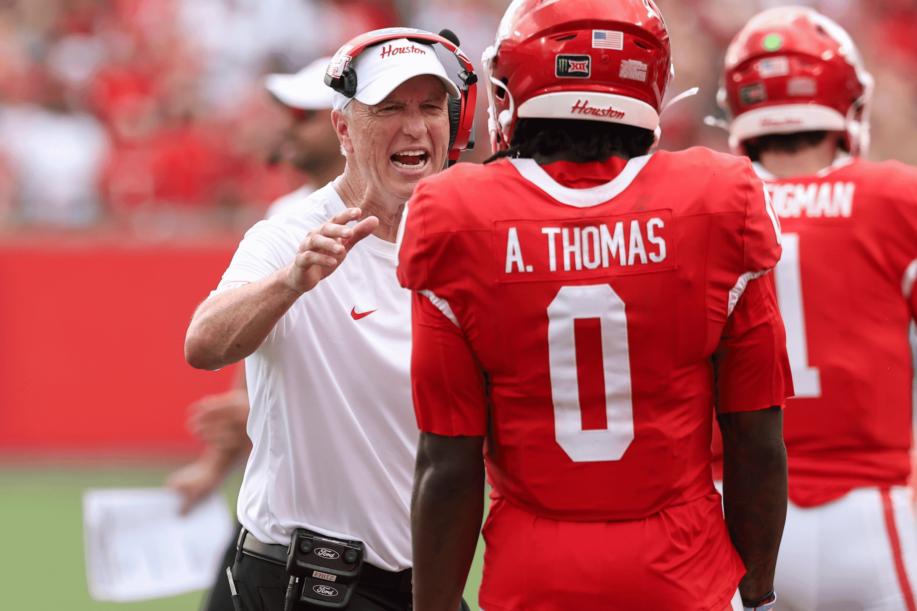 Sep 5, 2026; Houston, Texas, USA; Houston Cougars head coach Willie Fritz celebrates with wide receiver Amare Thomas (0) after a touchdown during the first quarter against the Oregon State Beavers at TDECU Stadium.