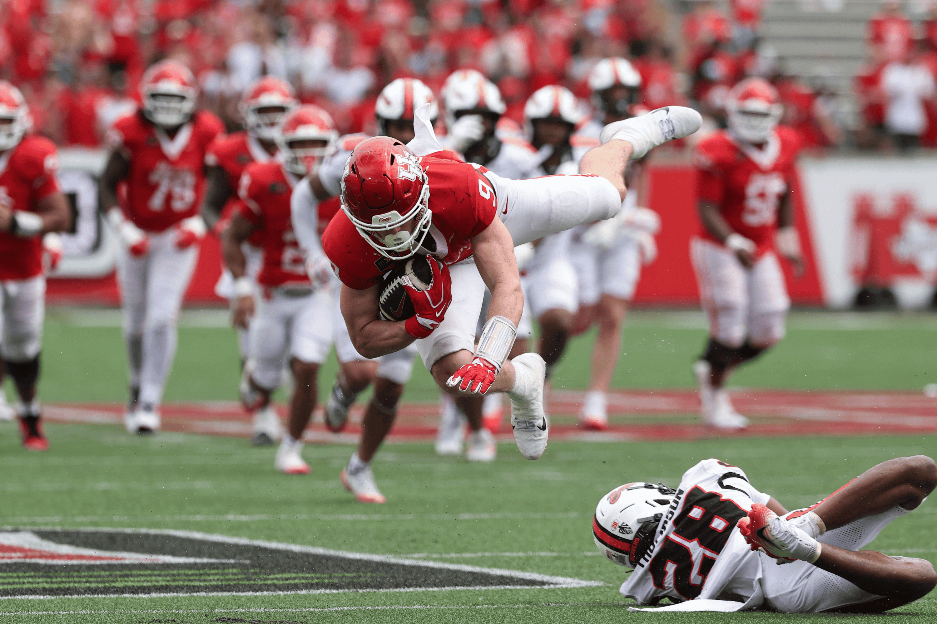 Sep 5, 2026; Houston, Texas, USA; Houston Cougars tight end Patrick Overmyer (9) leaps after making a reception during the fourth quarter against the Oregon State Beavers at TDECU Stadium.