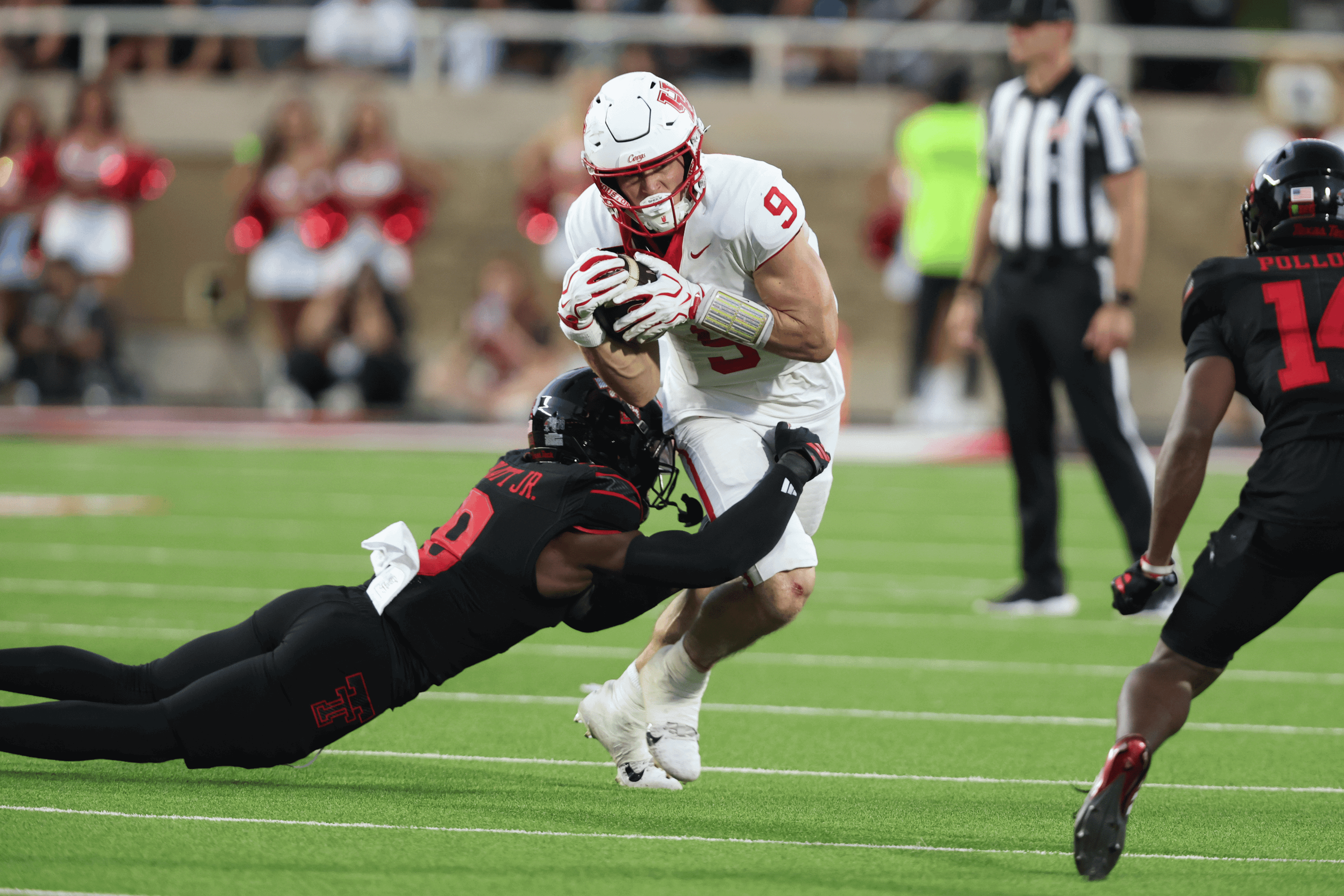 Sep 18, 2026; Lubbock, Texas, USA; Texas Tech Red Raiders defensive linebacker Corey Platt Jr. (9) tackes Houston Cougars tight end Patrick Overmyer (9) in the first half at Galaxy Stadium.
