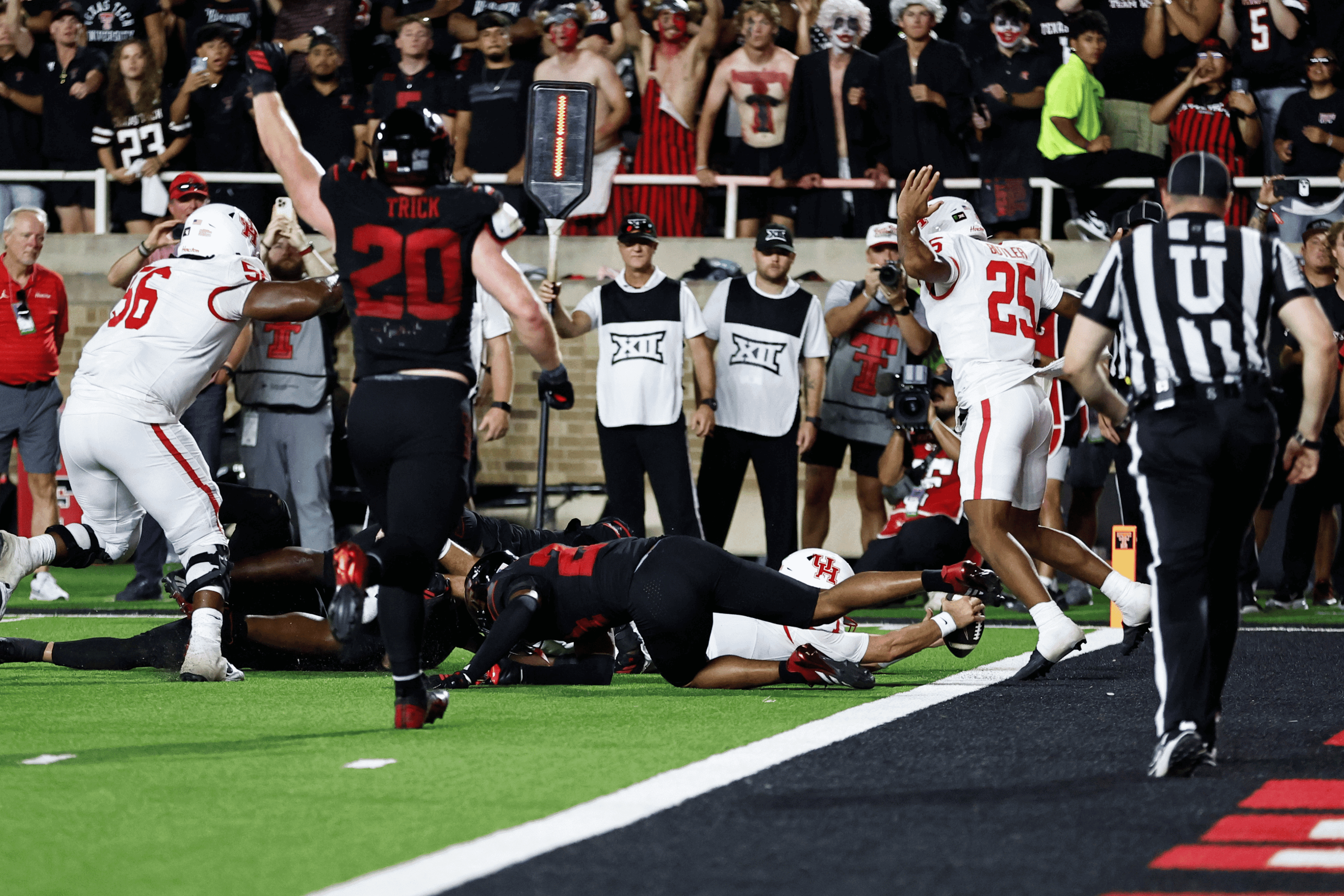 Sep 18, 2026; Lubbock, Texas, USA; Houston Cougars quarterback Conner Weigman (1) reaches for the goal line against the Texas Tech Red Raiders on a two-point attempt near the end of the fourth quarter at Galaxy Stadium.
