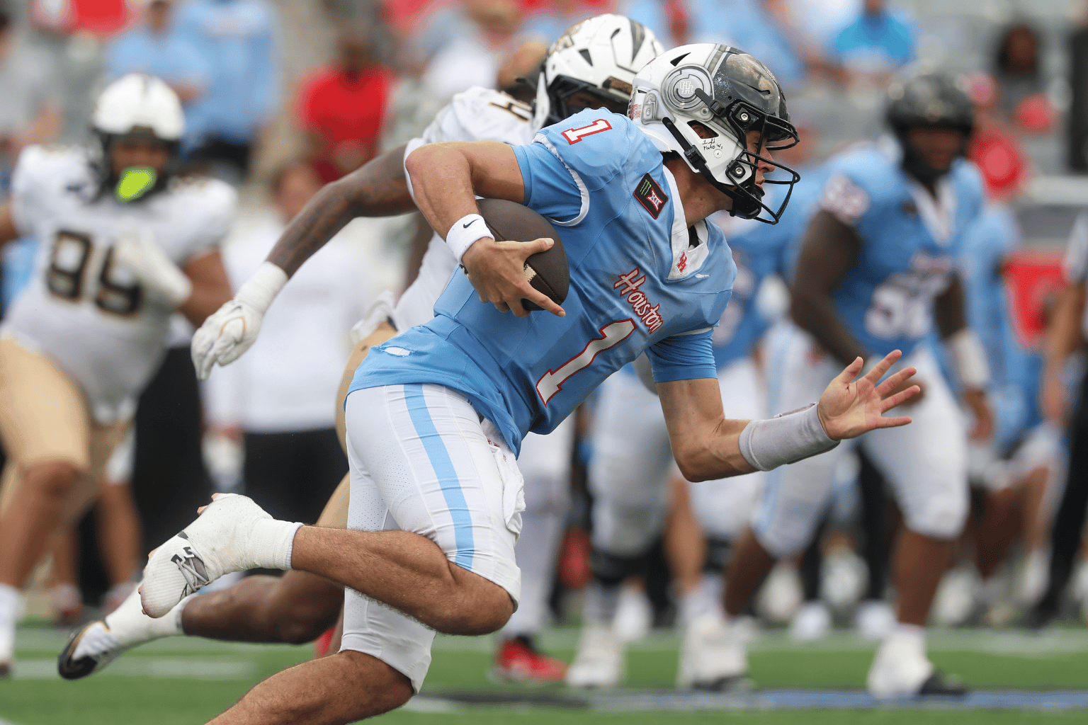 Oct 3, 2026; Houston, Texas, USA; Houston Cougars quarterback Conner Weigman (1) runs with the ball during the fourth quarter against the UCF Knights at TDECU Stadium