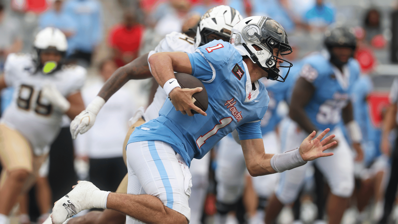 Oct 3, 2026; Houston, Texas, USA; Houston Cougars quarterback Conner Weigman (1) runs with the ball during the fourth quarter against the UCF Knights at TDECU Stadium.