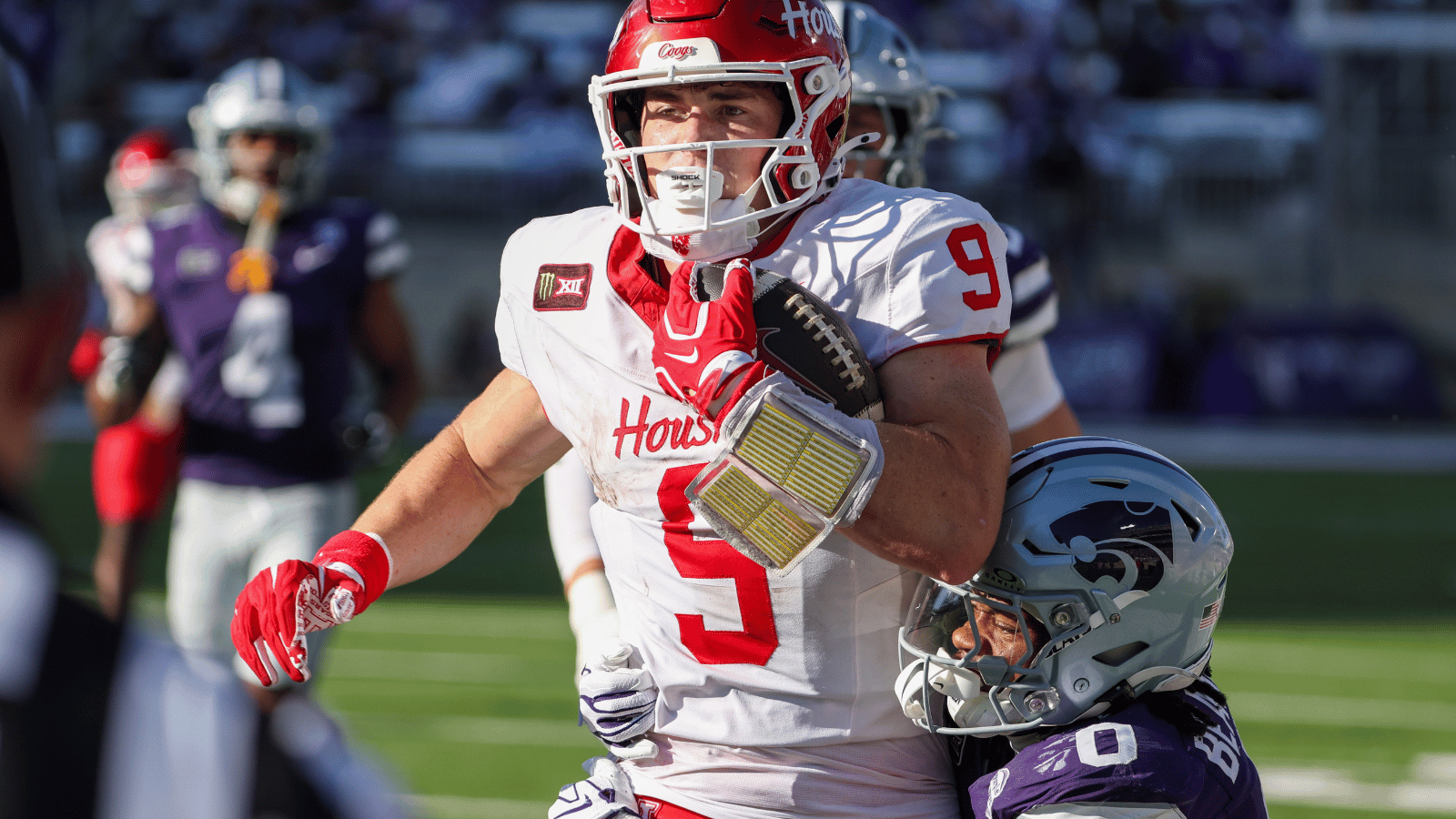 Oct 10, 2026; Manhattan, Kansas, USA; Houston Cougars tight end Patrick Overmyer (9) is tackled by Kansas State Wildcats cornerback Donovan McIntosh (9) during the second quarter at Bill Snyder Family Football Stadium