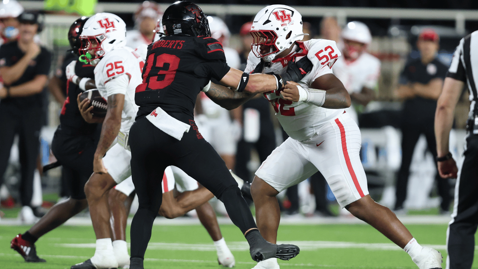 Sep 18, 2026; Lubbock, Texas, USA; Houston Cougars defensive lineman Anthony Boswell (52) blocks Texas Tech Red Raiders defesnive linebacker Ben Roberts (13) in the second half at Galaxy Stadium.