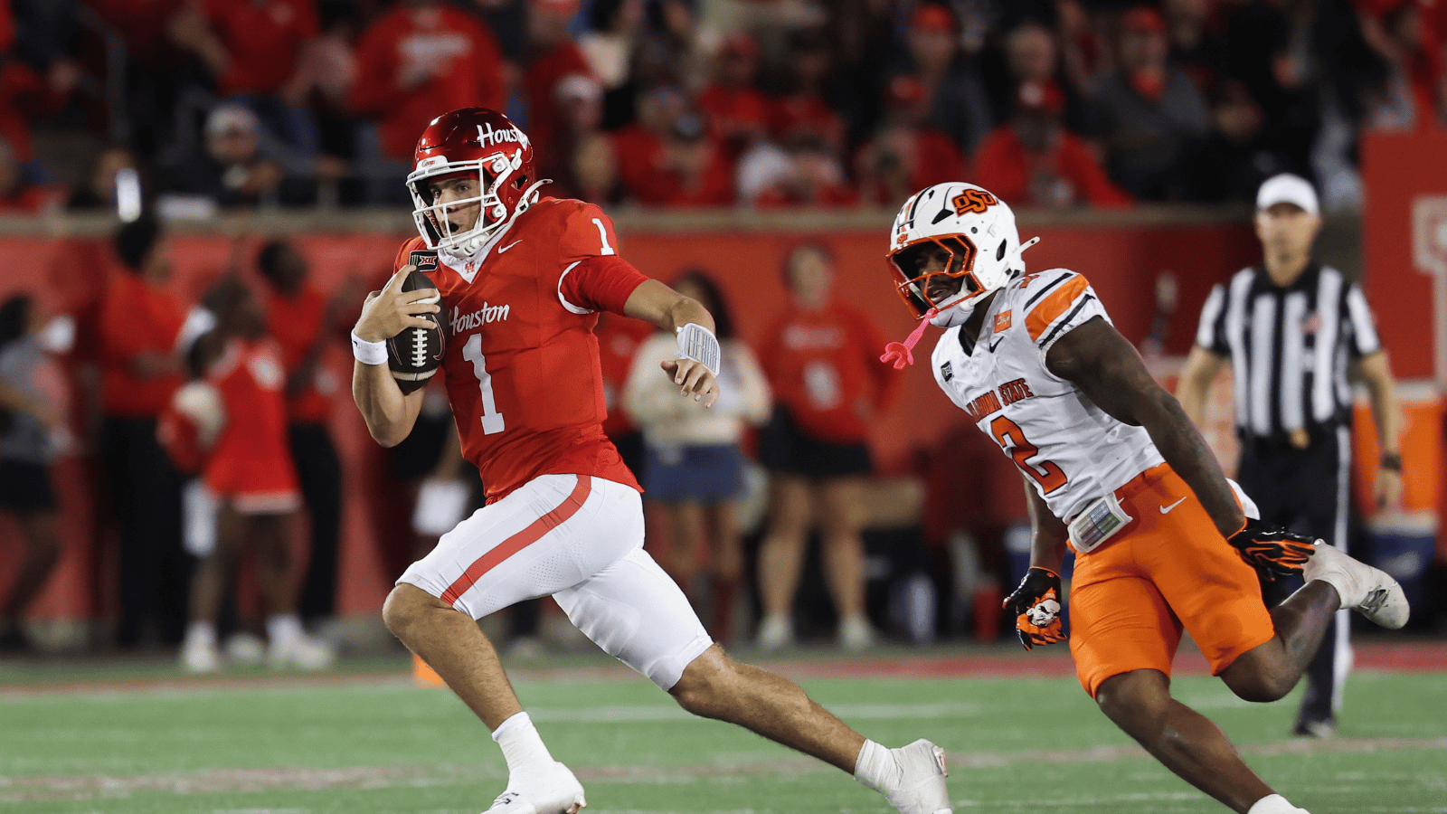 Oct 17, 2026; Houston, Texas, USA; Houston Cougars quarterback Conner Weigman (1) runs with the ball past Oklahoma State Cowboys linebacker Isaiah Chisom (2) during the third quarter at TDECU Stadium.
